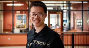 Headshot of Jonah Perry standing outside the Center for Career Excellence.