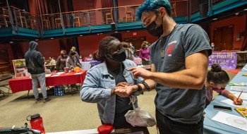 A photo of students at a Peer Health Network tabling event.