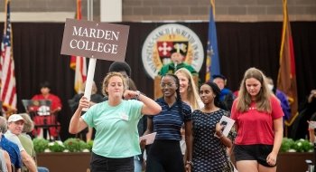 First-year students follow their Orientation Leader as they leave their Matriculation ceremony.