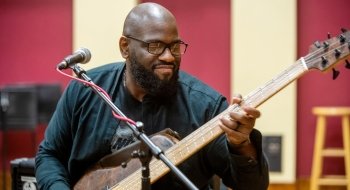 A musician plays an electric guitar.