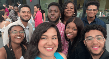 Haydee Matos smiles with a group of friends during the Expanding Diversity in Economics program.