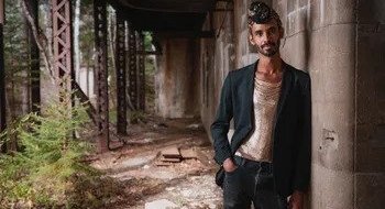 image of Jake Blount leaning against wall posing.