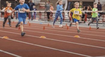 Image of children running inside St. Lawrence University Newell Field House racing to earn the title of &quot;Fastest Kid.&quot;