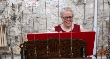 Janel Smith smiles as she rings the chapel bells.