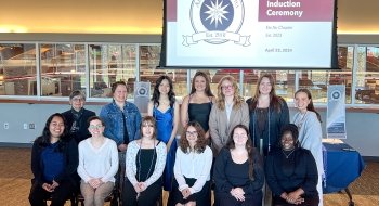 A group of people sitting for an induction ceremony