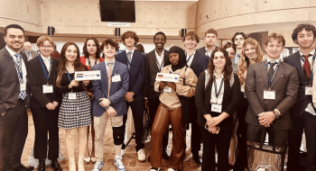 Photo of students from Mert Kartals Class standing for group photo at the SUNYMEU Event