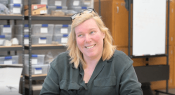 Judith Nagel-Myers sits in a geology lab.