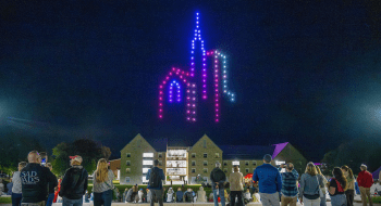 Drone light show at Saint Lawrence University featuring the University chapel