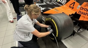 Cordelia Sherwood '26 replaces wheel on racecar