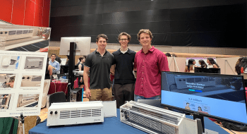From left to right: Cole Ames '24, Nick Walker, and Austin Riesenberger '24 pictured with their SWERV energy recovery ventilator prototype