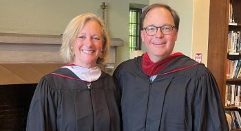 Krissie Bonin and Brad Rauch wearing graduation regalia.
