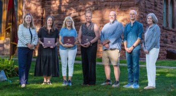 President Morris accompanied by 2026 faculty and staff award winners.