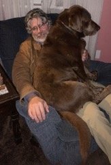 Man sitting with a dog