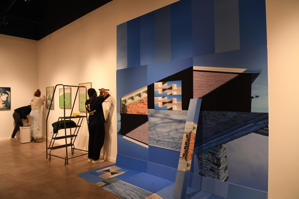Michael Yirenkyi '22 puts the finishing touches on his floor-to-ceiling gallery exhibit, featuring a compilation of architectural fixtures from different buildings.