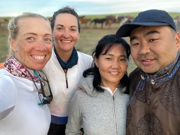 two riders with local Mongolian couple host