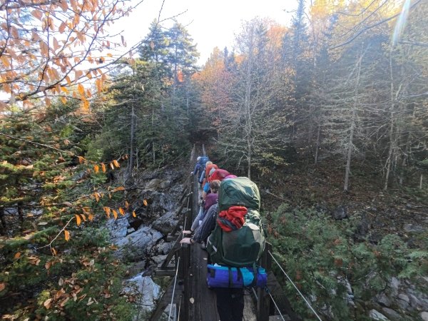 Arcadians crossing a bridge on day 2 of the trip.