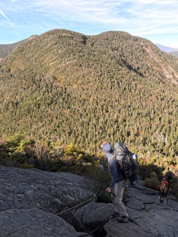 Keegan appreciates a view of Saddleback while scaling Gothics, with Hannah close behind.