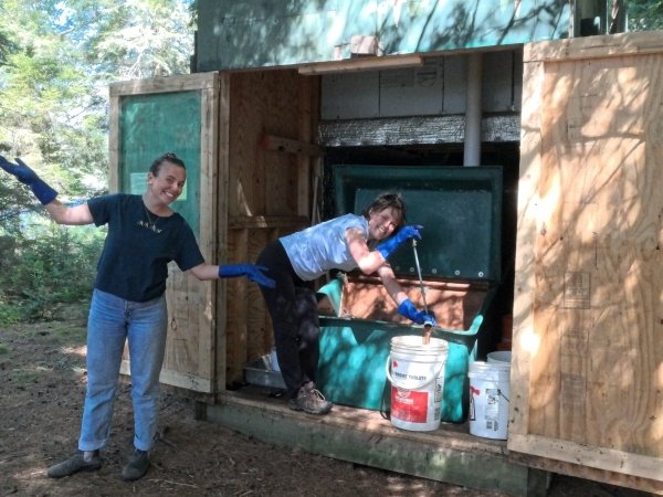 Arcadians Maddy and Marina tend to our toilet system, the Clive.