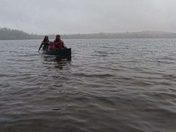 Arcadians paddling to woodworking class on a misty morning.