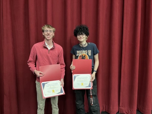 Students holding certificates 