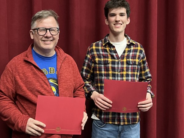 Marc and Elijah hold certifcates