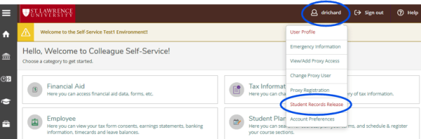 Screenshot of the St. Lawrence University Colleague Self-Service homepage. The user profile menu in the upper-right corner is highlighted with a blue circle. The expanded menu shows several options, including User Profile, Emergency Information, View/Add Proxy Access, Change Proxy User, Proxy Registration, Student Records Release, and Account Preferences. The "Student Records Release" option is also highlighted with a blue circle, indicating the user should select it.