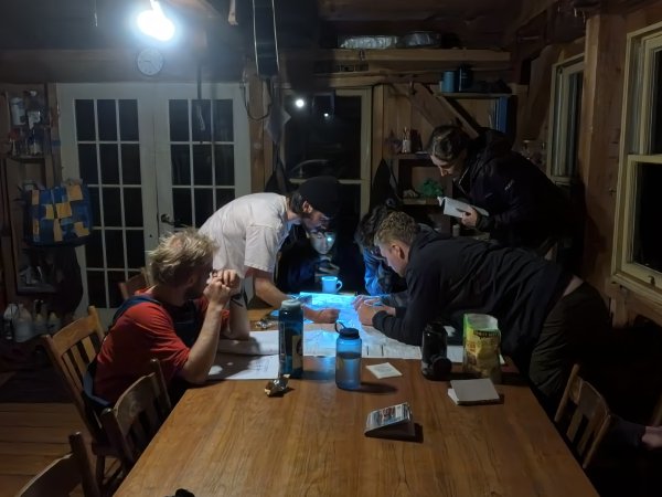 Backpacking group #2 (The Bar Chord) working on their route plans for an E.L.R.A. class.