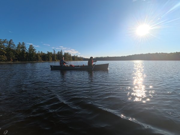 Peyton Hunsicker left and Spencer Kavanagh (right), paddling on their morning commute to class.