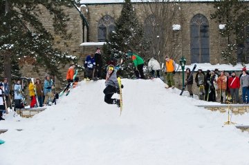 Student jumping on snowboard