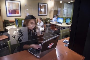 A Laurentian works on a laptop at the Washington Center in Washington D.C.