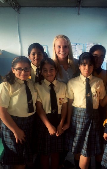 Kaleigh White with children at a Augusto Alva Ascurra public school in Trujillo, Peru.