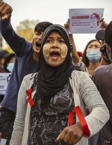 woman protesting martial law in Myanmar