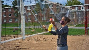 Person cleaning volleyball net
