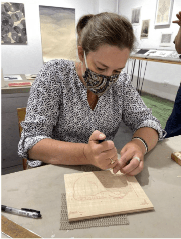 woman carving a woodblock