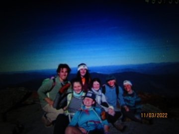 Hikers pose at the summit of Algonquin peak.