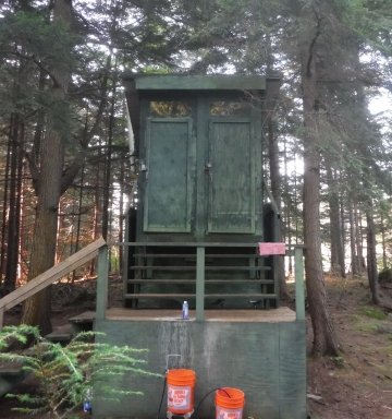 This is Clivus, our composting toilet, towering over the pine scattered village.