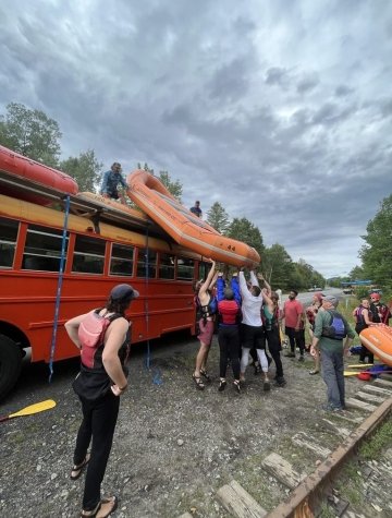 Loading rafts on the bus to head back to base camp.