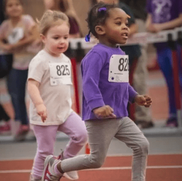 image of 2 children running in the fastest kid competition