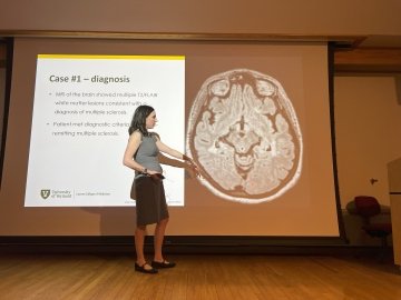 woman presenting at lecture