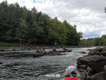 Beckley and Leah running the Raquette River rapids.