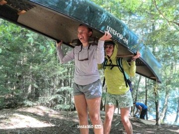 Jordanna helping Maddy with her first portage of the day (from day 2 of the trip).