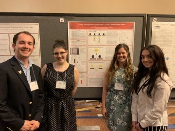 Students presenting research at a conference