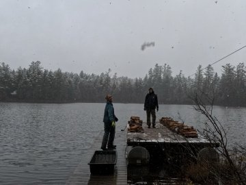 Arcadians Rachael Welch and Lars Fattinger schlepping wood in the snow.