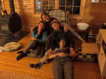 Arcadians lounging in assistant director Nate Trachte’s house on a field trip. From left: Lars, Eva, Beckley, Garen.
