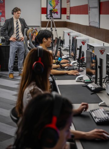 Saint Lawrence University Esports Coordinator Kadin deRuijter coaching an esports team