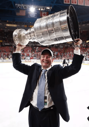 Ray Shero '84 hoisting the Stanley Cup, which he won as General Manager of the Pittsburgh Penguins