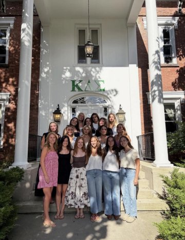 KDS Members on the steps of their house