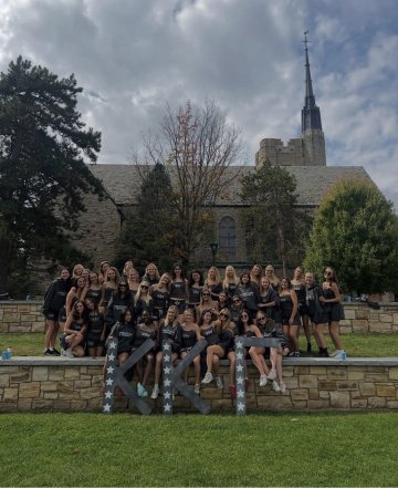 Kappa members with their greek letters on the quad