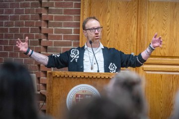 Charles A. Dana Professor of Mathematics Dan Look presenting on mathematical analyses of popular literary stories