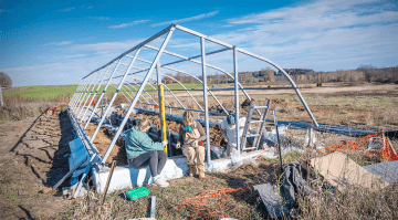 Students helping construct the greenhouse